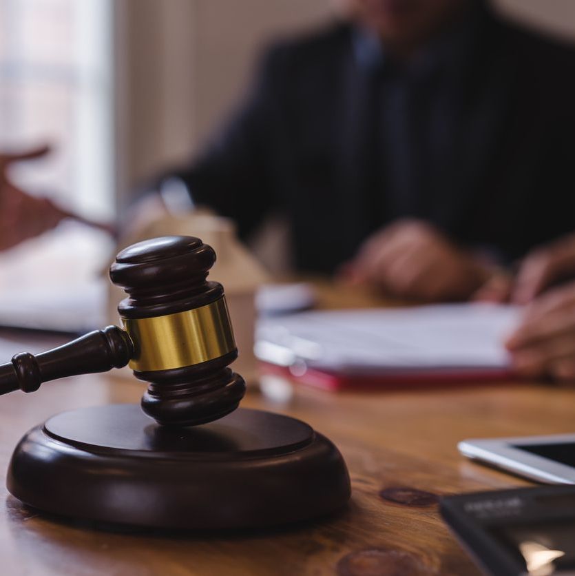 Group of people and lawyer or judge team discussing